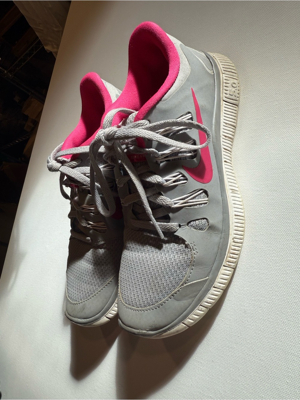 Nike Women's Gray Athletic Sneakers with Pink Accents